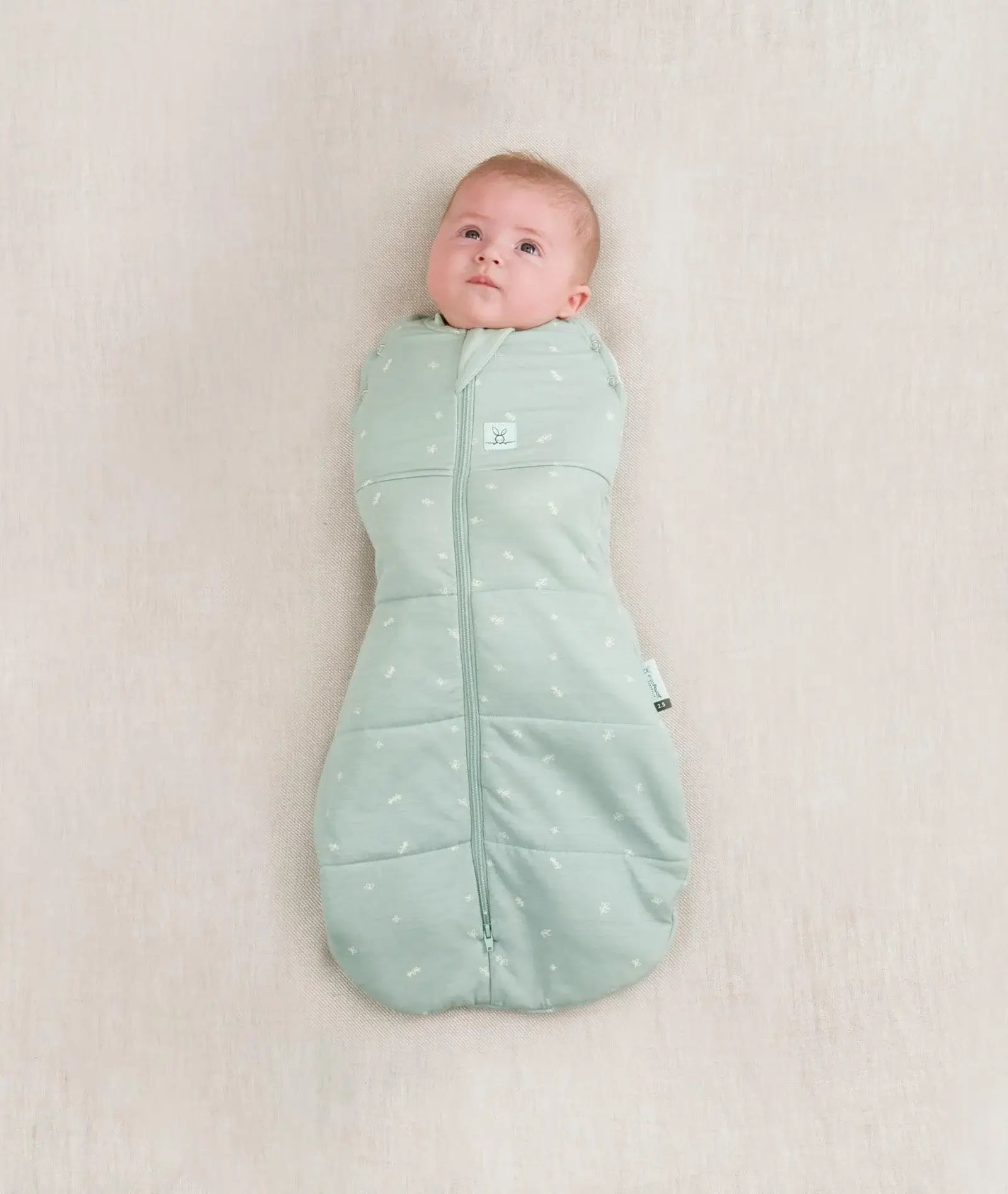 ergoPouch Cocoon Swaddle Bag 2.5 tog in sage — a secure, multifunctional infant sleep sack designed for newborns, featuring a zip-up swaddle-to-sleep transition, breathable natural fabric, and extra warmth for cooler nights.