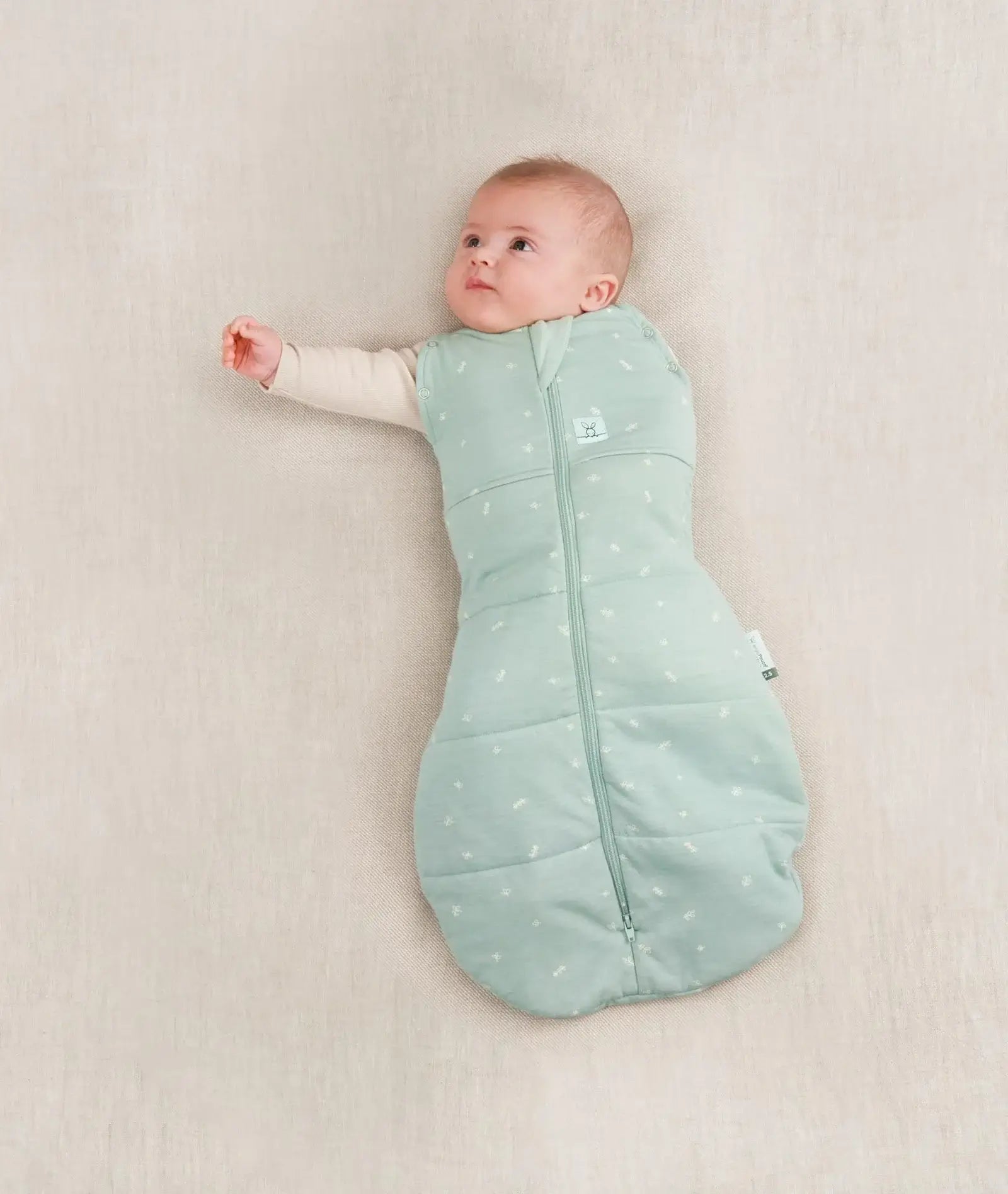 ergoPouch Cocoon Swaddle Bag 2.5 tog in sage — a secure, multifunctional infant sleep sack designed for newborns, featuring a zip-up swaddle-to-sleep transition, breathable natural fabric, and extra warmth for cooler nights.