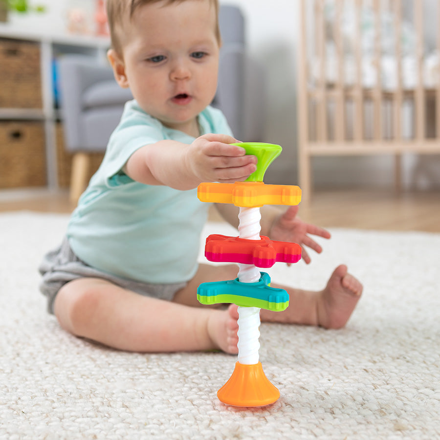Fat Brain Toys MiniSpinny sensory propeller tower – three vibrant spectral-colour discs that spin down a corkscrew pole, designed to engage toddlers aged 10 months + in tactile play, early counting and colour recognition