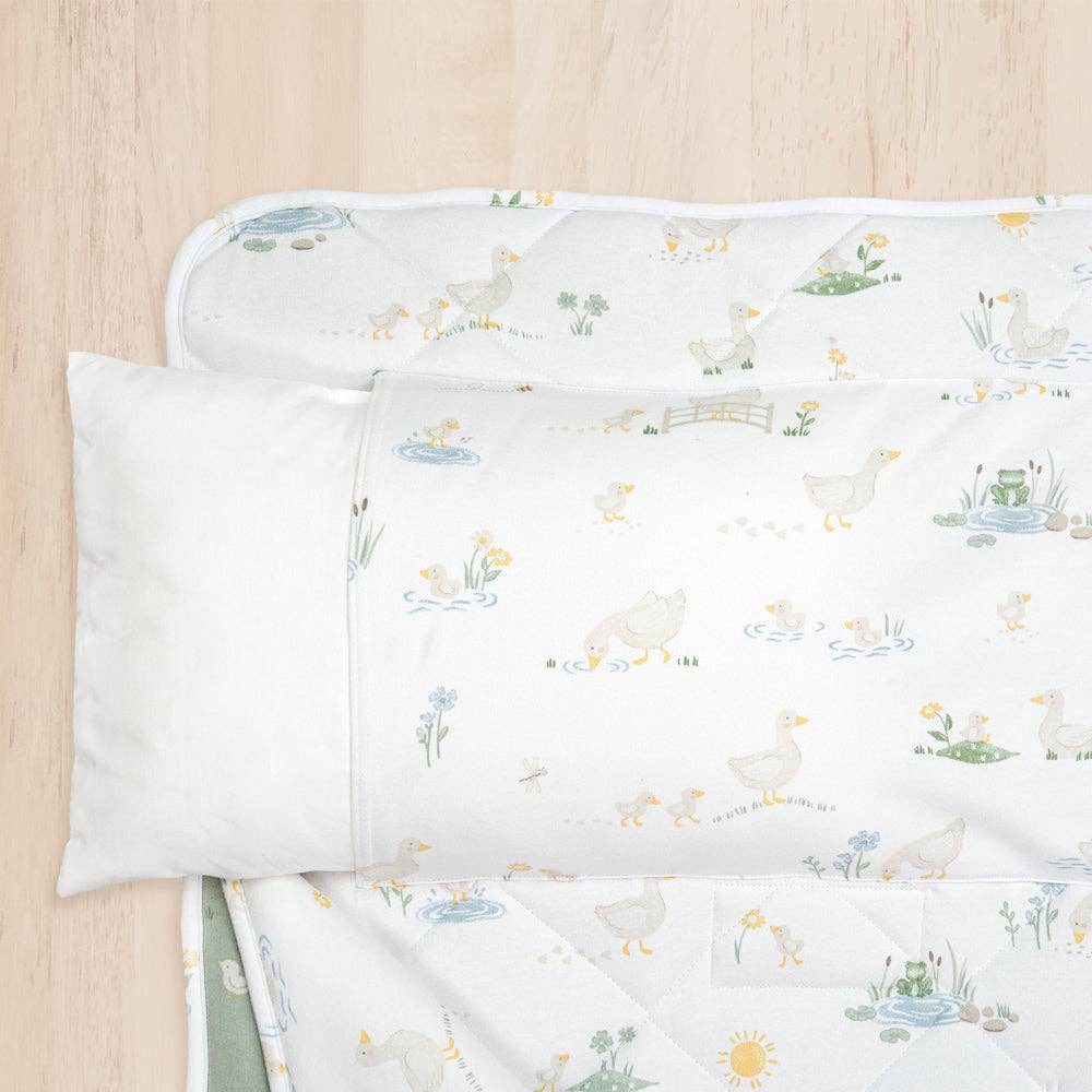 Living Textiles Deluxe Nap Mat – Goosey Goosey design on sage‑tone organic cotton jersey with built‑in pillow and blanket, quilted base, four elastic loops for daycare stacker beds, carry handle and name label