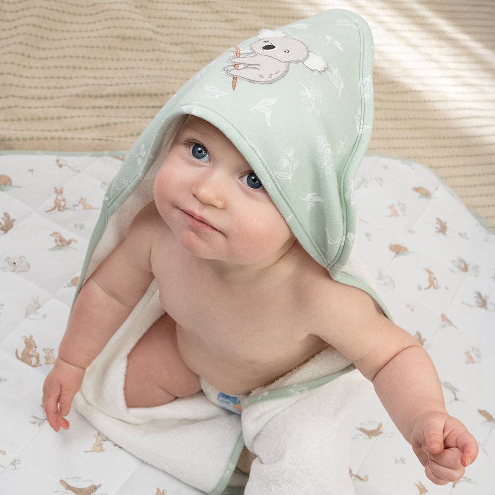 Living Textiles Organic Hooded Towel – Australiana design featuring native animals and botanical embroidery in calming sage tones; made from 100% organic cotton terry with soft jersey hood for cozy post-bath snuggles