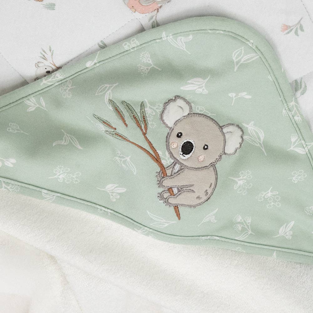 Living Textiles Organic Hooded Towel – Australiana design featuring native animals and botanical embroidery in calming sage tones; made from 100% organic cotton terry with soft jersey hood for cozy post-bath snuggles