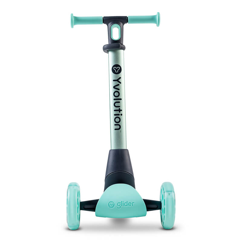 YGlider Nua green 2‑in‑1 foldable lean‑to‑steer scooter – lightweight kids’ scooter with adjustable arc‑folding handlebar, LED front wheels, wide rear wheel and wall‑mount accessory