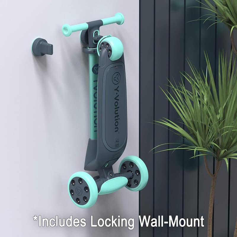 YGlider Nua green 2‑in‑1 foldable lean‑to‑steer scooter – lightweight kids’ scooter with adjustable arc‑folding handlebar, LED front wheels, wide rear wheel and wall‑mount accessory