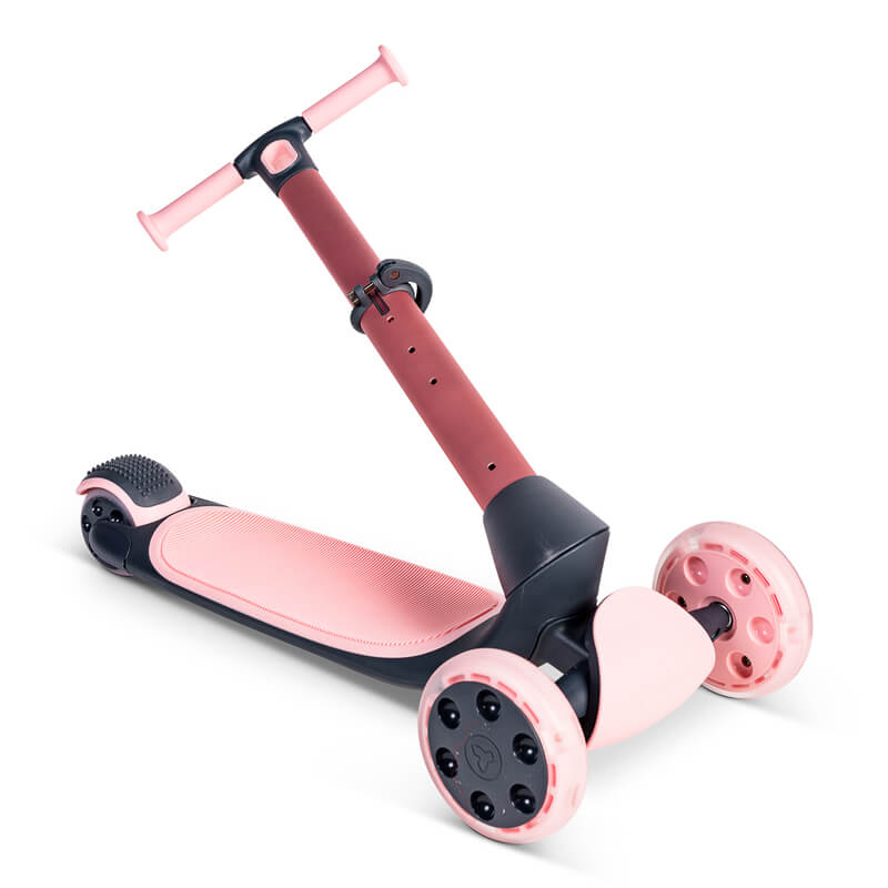 YGlider Nua pink 2‑in‑1 foldable lean‑to‑steer scooter – lightweight kids’ scooter with adjustable arc‑folding handlebar, LED front wheels, wide rear wheel and wall‑mount accessory