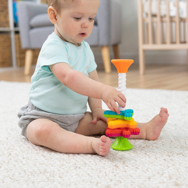 Fat Brain Toys MiniSpinny sensory propeller tower – three vibrant spectral-colour discs that spin down a corkscrew pole, designed to engage toddlers aged 10 months + in tactile play, early counting and colour recognition