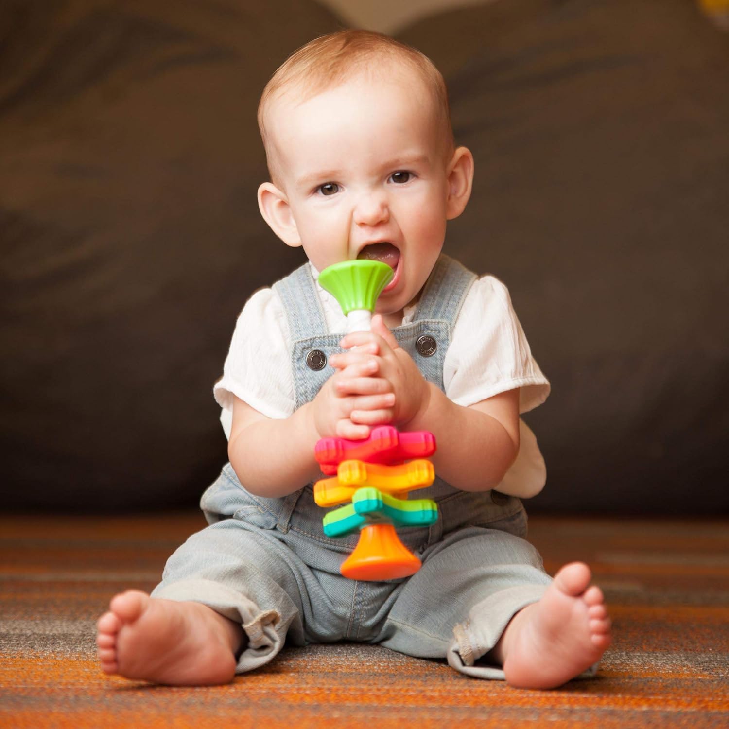 Fat Brain Toys MiniSpinny sensory propeller tower – three vibrant spectral-colour discs that spin down a corkscrew pole, designed to engage toddlers aged 10 months + in tactile play, early counting and colour recognition