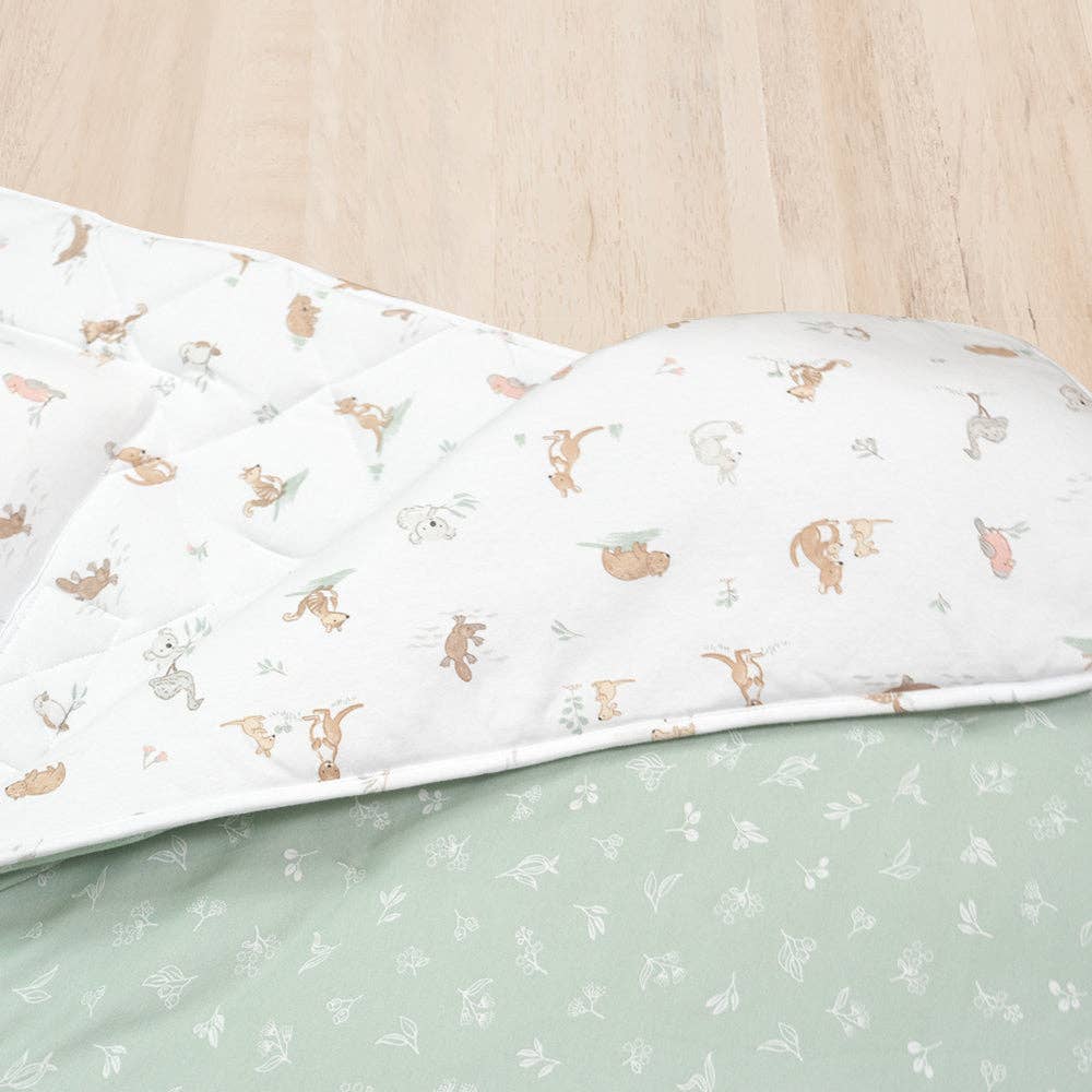 Living Textiles Deluxe Nap Mat – Australiana design on sage‑tone organic cotton jersey with built‑in pillow and blanket, quilted base, four elastic loops for daycare stacker beds, carry handle and name label