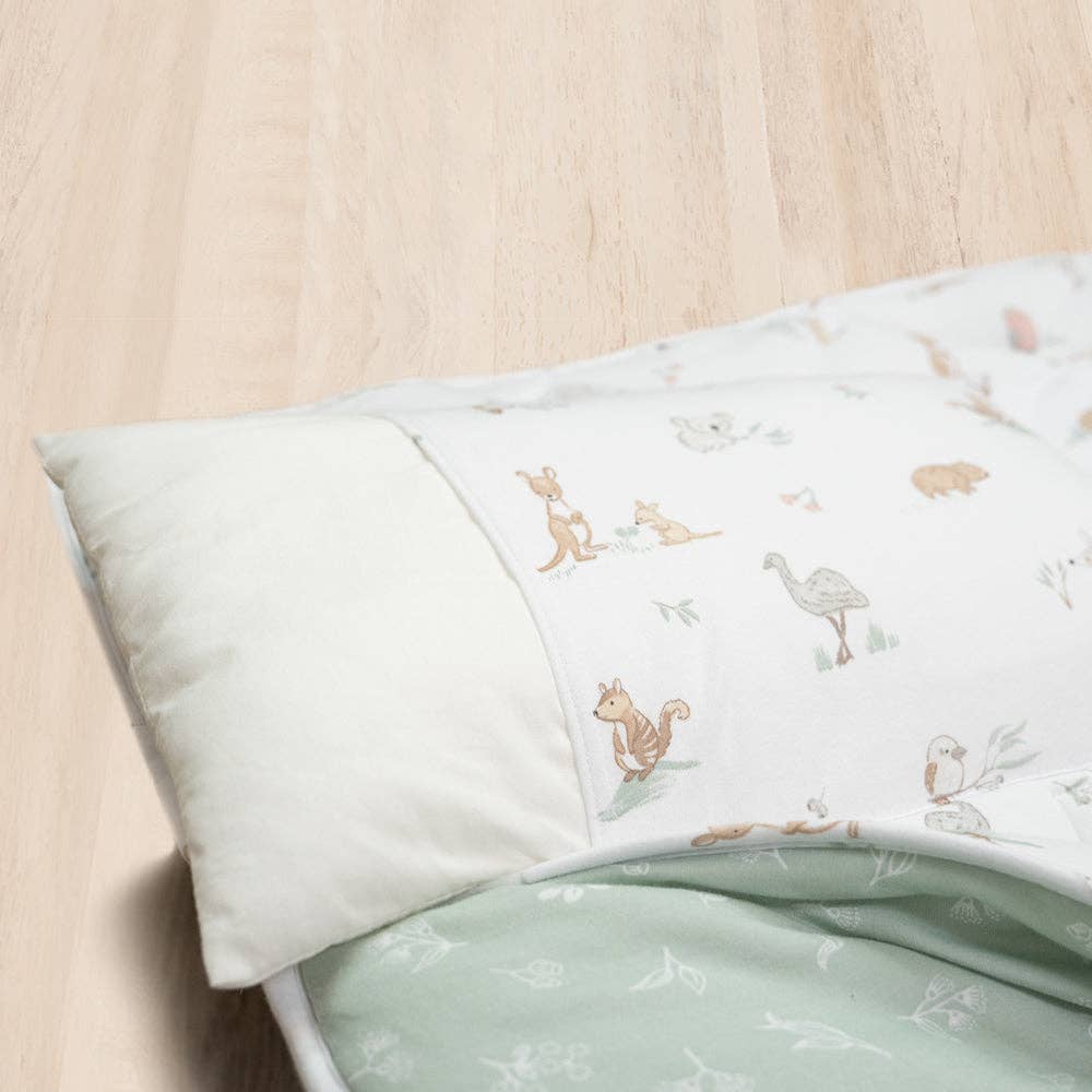 Living Textiles Deluxe Nap Mat – Australiana design on sage‑tone organic cotton jersey with built‑in pillow and blanket, quilted base, four elastic loops for daycare stacker beds, carry handle and name label