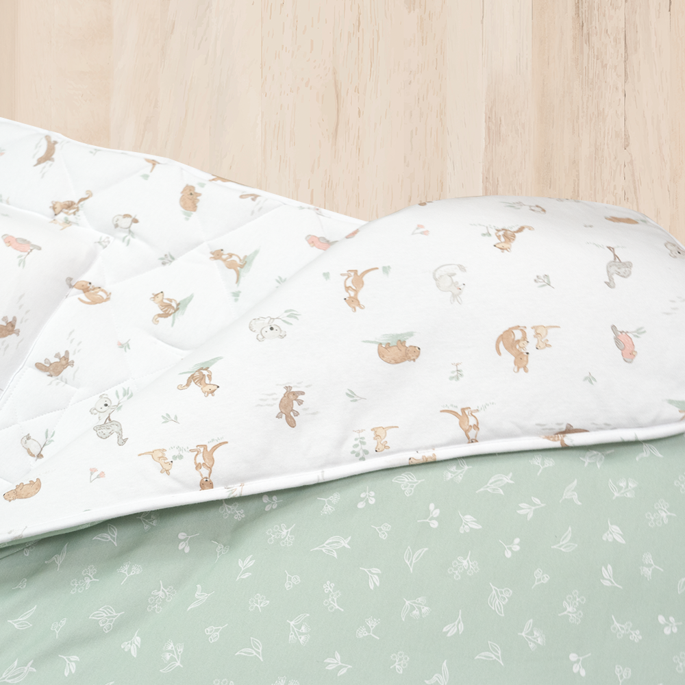 Living Textiles Deluxe Nap Mat – Australiana design on sage‑tone organic cotton jersey with built‑in pillow and blanket, quilted base, four elastic loops for daycare stacker beds, carry handle and name label