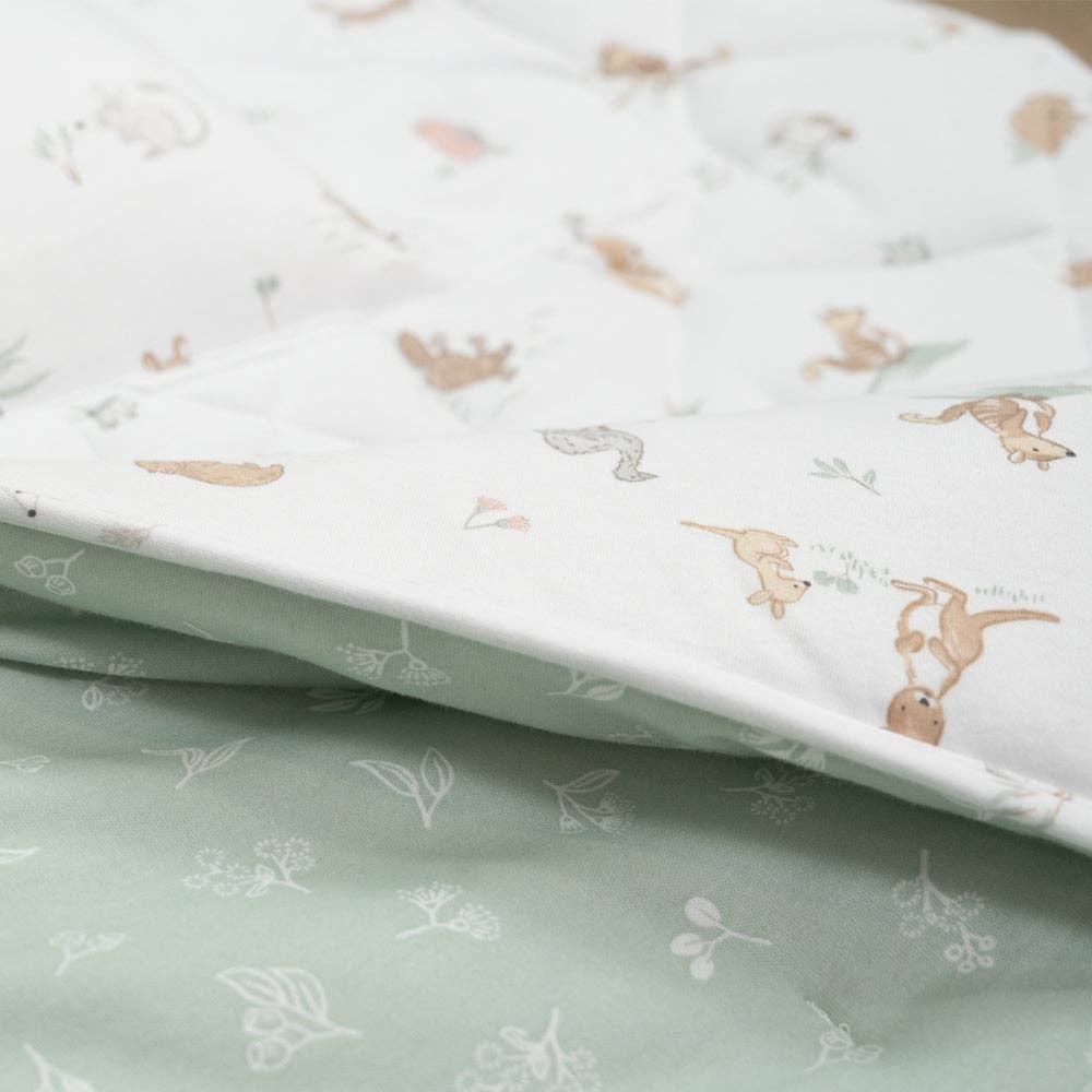 Living Textiles Deluxe Nap Mat – Australiana design on sage‑tone organic cotton jersey with built‑in pillow and blanket, quilted base, four elastic loops for daycare stacker beds, carry handle and name label