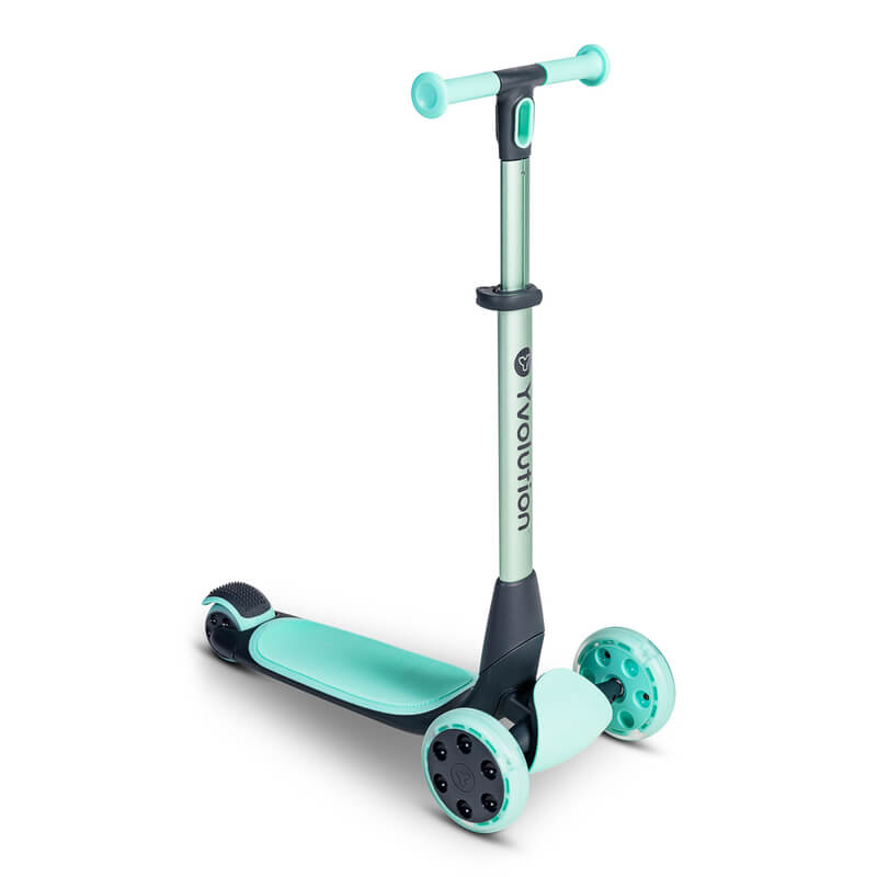 YGlider Nua green 2‑in‑1 foldable lean‑to‑steer scooter – lightweight kids’ scooter with adjustable arc‑folding handlebar, LED front wheels, wide rear wheel and wall‑mount accessory