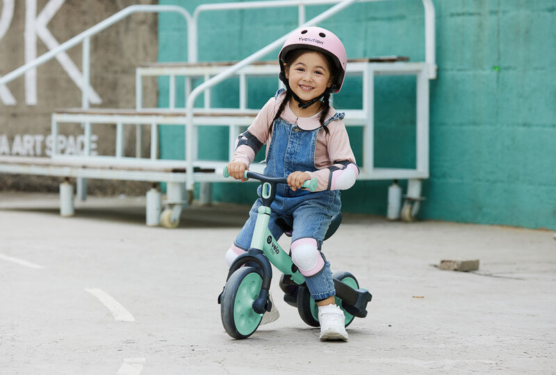Yvolution Velo Trike 2‑in‑1 green – adjustable-seat toddler trike with flip‑to‑balance rear wheels, quiet puncture‑proof tires, soft-touch frame and pedal storage