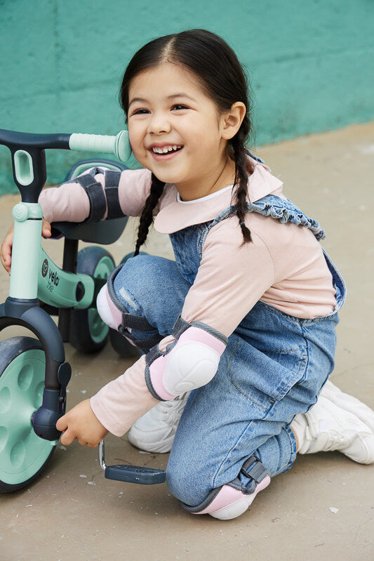 Yvolution Velo Trike 2‑in‑1 green – adjustable-seat toddler trike with flip‑to‑balance rear wheels, quiet puncture‑proof tires, soft-touch frame and pedal storage